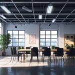 Oficinas modernas de una startup tecnológica con gráficos de sustentabilidad sobre la mesa