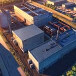 Vista aérea de un parque industrial con edificios modernos al amanecer