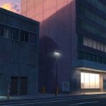 Edificio moderno y tecnológico en un entorno urbano al atardecer, con luces encendidas.