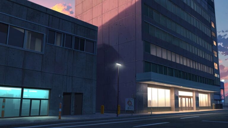 Edificio moderno y tecnológico en un entorno urbano al atardecer, con luces encendidas.