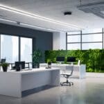 Oficina moderna con elementos tecnológicos y plantas verdes representando salud y tecnología