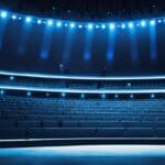 Auditorio moderno con luces azules brillantes y un escenario tecnológico en el centro