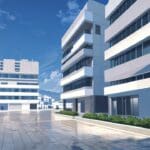 Vista de un moderno centro de innovación tecnológica en Grecia con edificios contemporáneos iluminados.