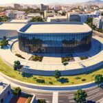 Vista aérea de un centro de convenciones moderno rodeado de arquitectura urbana contemporánea en Córdoba.