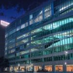 Edificios modernos de oficinas tecnológicas con luces encendidas al anochecer