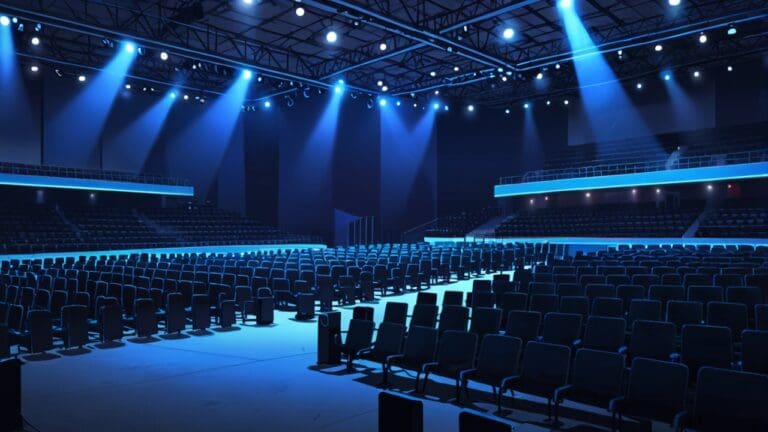 Moderno centro de convenciones iluminado con luces azules, representativo de un evento tecnológico innovador