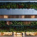 Edificio moderno con diseño vanguardista rodeado de vegetación en Barcelona