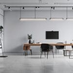 Oficina moderna con decoración minimalista y dispositivos tecnológicos.