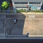 Vista cenital de una ciudad moderna con zonas de estacionamiento digitalizadas y señalización tecnológica