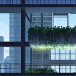 Vista urbana de Buon Ma Thuot con edificios modernos y vegetación alrededor, reflejando innovación ambiental en un entorno corporativo