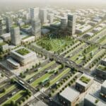 Vista aérea de una ciudad inteligente con espacios verdes y transporte eléctrico