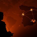 Bases militares estadounidenses en España marcadas en un mapa con un líder político mirando, ilustrando tensión geopolítica y estratégica tras la posible retirada de fuerzas.