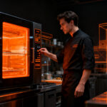 Automatización en cocinas profesionales mediante equipos programables para optimizar la eficiencia operativa en hostelería.